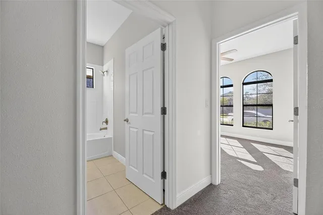 an aerial view of multiple houses with a big yard