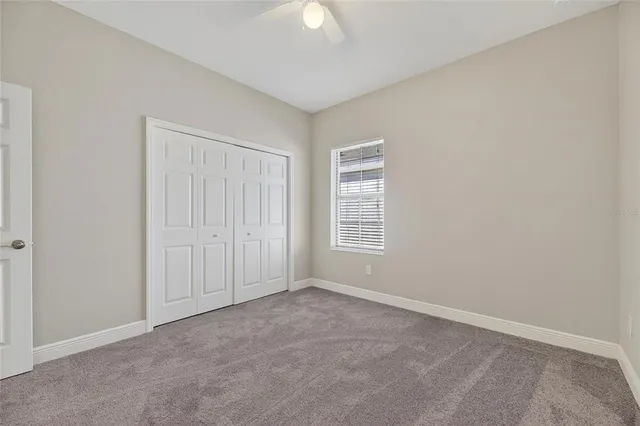 an aerial view of a house with garden space and lake view