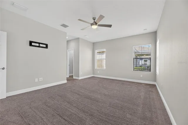 an aerial view of a house with a lake view