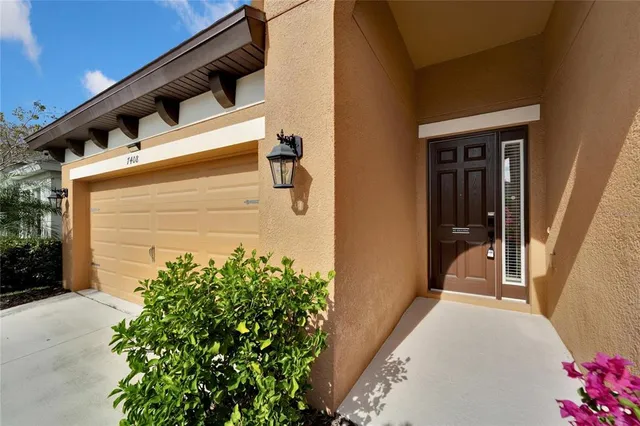 a bathroom with a granite countertop sink toilet a large mirror a shower and a vanity