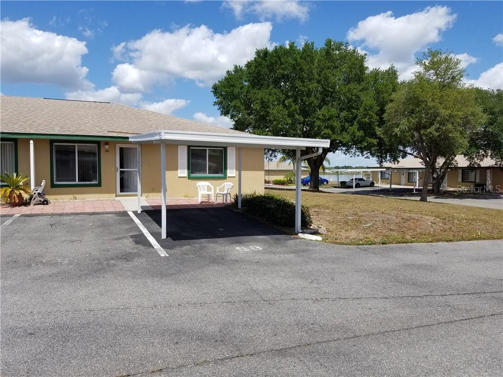 88 Winter Ridge Road, Unit 88 Winter Haven, FL 33881 - Photo 1 of 1 a view of a house with a patio