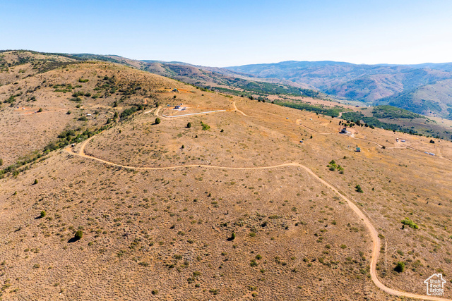 3243 Oak Canyon Road, Unit 488 Huntsville, UT 84317 - Photo 17 of 28 Aerial view of sparsely populated area featuring a mountainous background