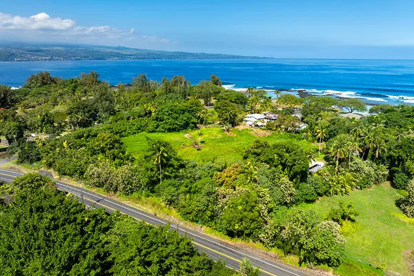 a view of a field with an ocean