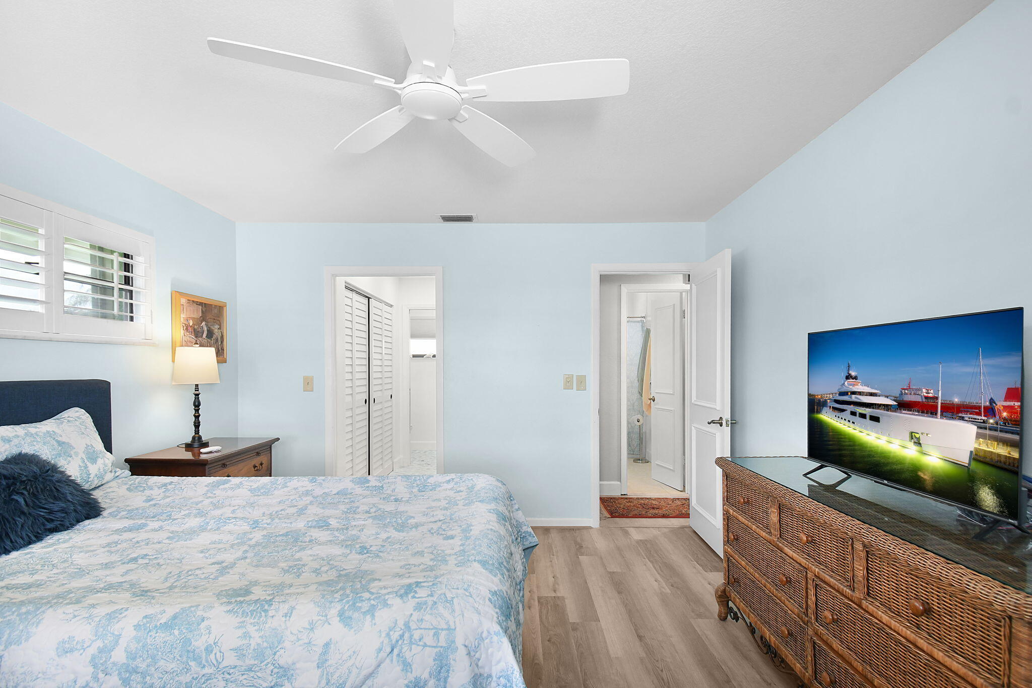 5251 Southeast Sea Island Way Stuart, FL 34997 - Photo 20 of 68 a bedroom with a bed and a dresser