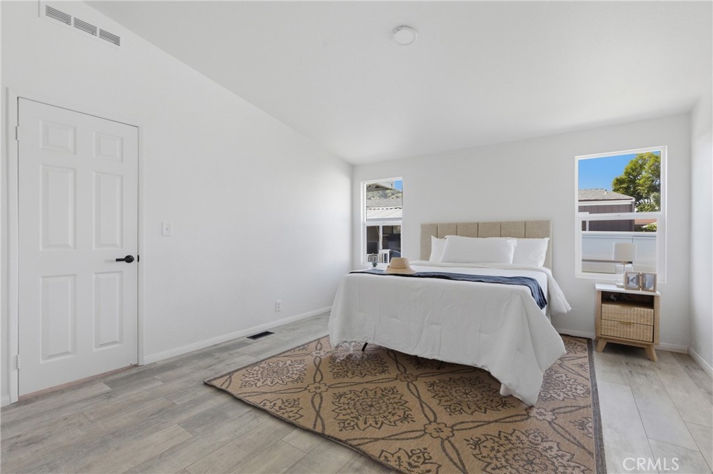 4901 Green River Road, Unit 153 Corona, CA 92878 - Photo 17 of 55 a bedroom with a bed and a window
