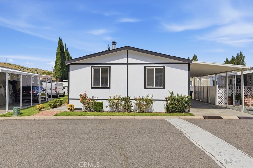 4901 Green River Road, Unit 153 Corona, CA 92878 - Photo 2 of 55 a view of house with a outdoor space and porch
