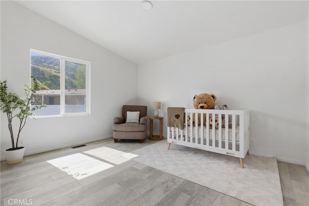 4901 Green River Road, Unit 153 Corona, CA 92878 - Photo 23 of 55 a bedroom with furniture and windows