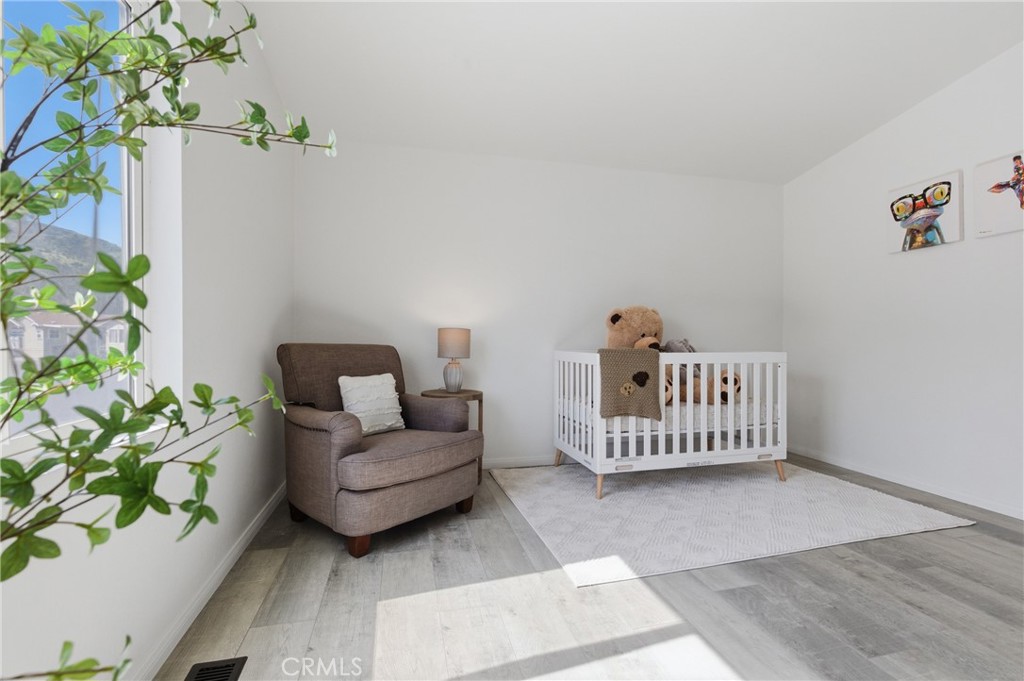 4901 Green River Road, Unit 153 Corona, CA 92878 - Photo 25 of 55 a living room with a couch and a potted plant