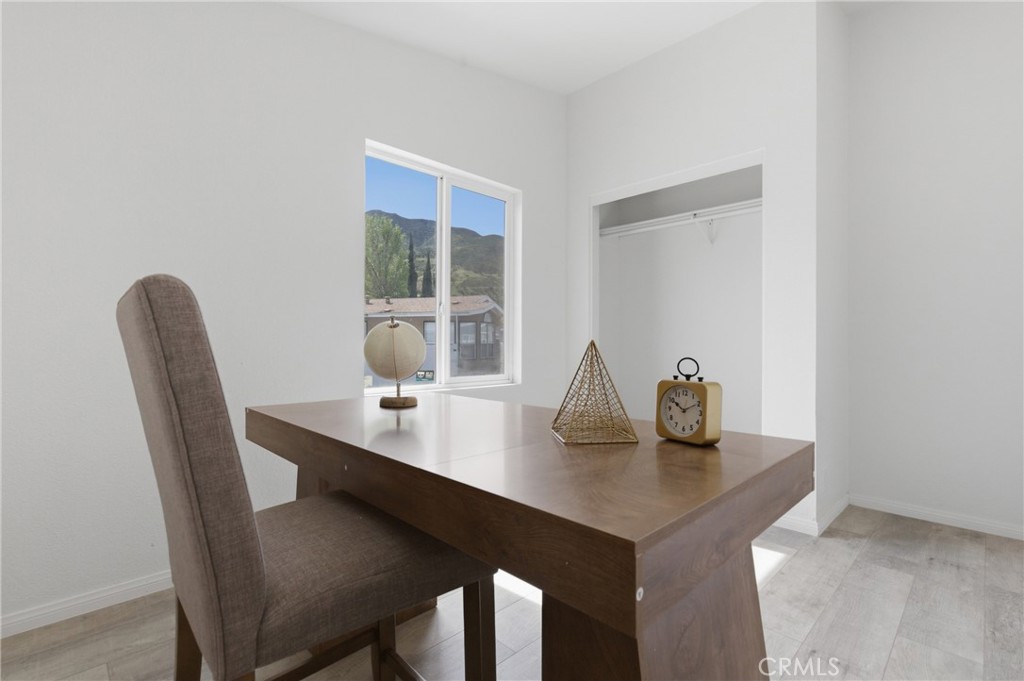 4901 Green River Road, Unit 153 Corona, CA 92878 - Photo 28 of 55 a view of a dining room with a table and chairs