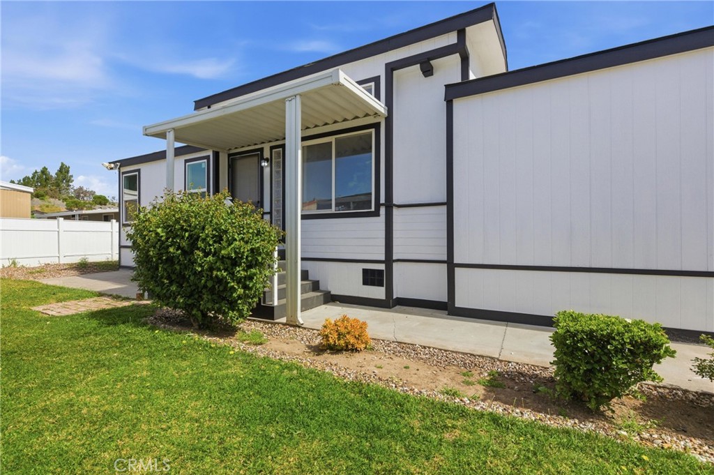 4901 Green River Road, Unit 153 Corona, CA 92878 - Photo 33 of 55 a view of a back yard of the house