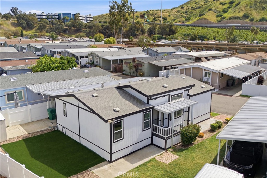 4901 Green River Road, Unit 153 Corona, CA 92878 - Photo 38 of 55 an aerial view of a house with a yard