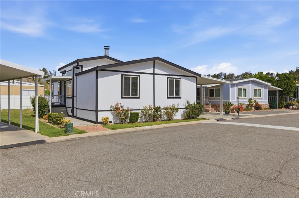 4901 Green River Road, Unit 153 Corona, CA 92878 - Photo 4 of 55 a white house with a outdoor space