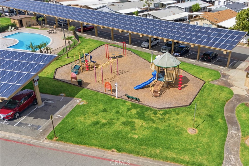 4901 Green River Road, Unit 153 Corona, CA 92878 - Photo 46 of 55 an aerial view of a house with garden space and street view