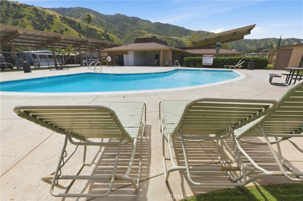 4901 Green River Road, Unit 153 Corona, CA 92878 - Photo 49 of 55 a view of a terrace with chairs