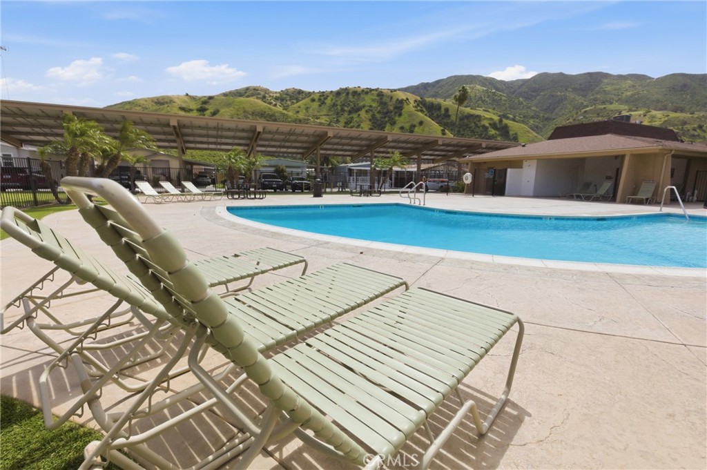 4901 Green River Road, Unit 153 Corona, CA 92878 - Photo 50 of 55 a view of a terrace with a lake view