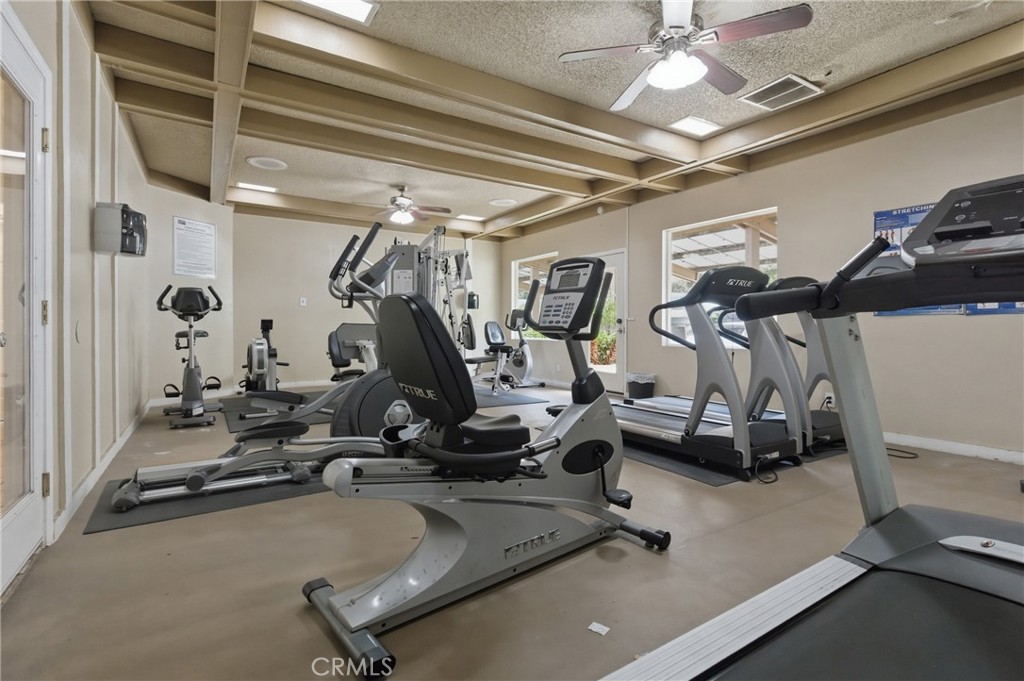 4901 Green River Road, Unit 153 Corona, CA 92878 - Photo 53 of 55 a view of a room with gym equipment