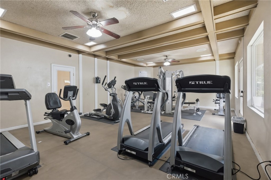 4901 Green River Road, Unit 153 Corona, CA 92878 - Photo 54 of 55 a view of a room with gym equipment