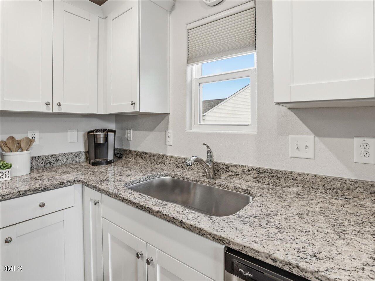 90 Barnsley Road Angier, NC 27501 - Photo 15 of 40 a kitchen with granite countertop a sink and cabinets