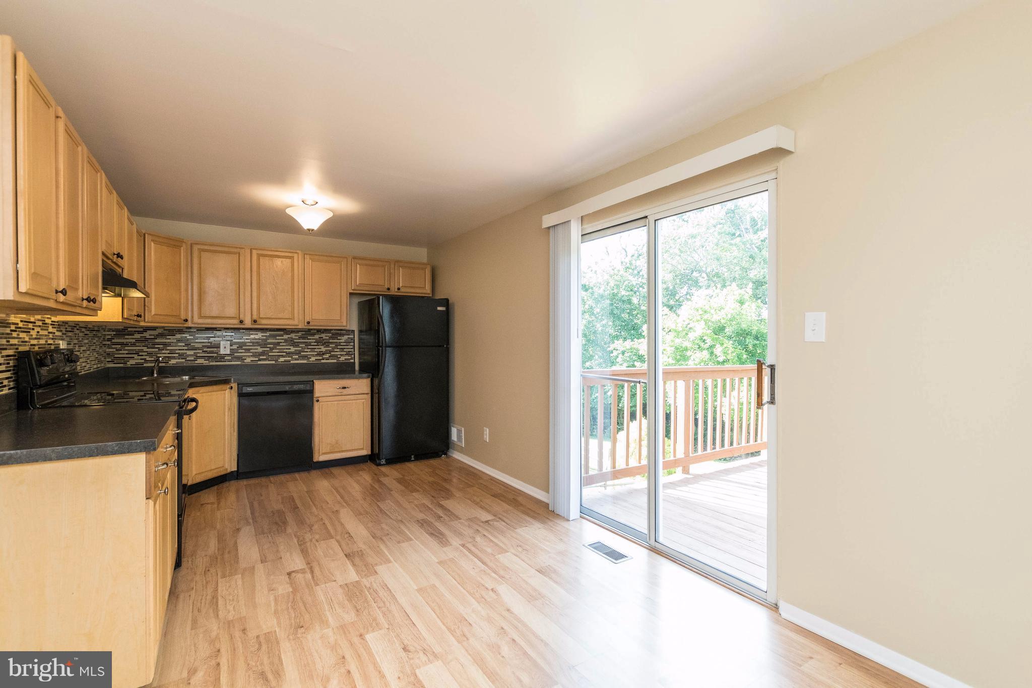 2041 Wintergreen Place Rosedale, MD 21237 - Photo 10 of 30 Sliding Glass Doors to Deck overlooking Rear Yard