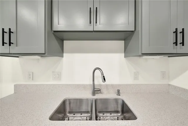 a kitchen with a sink and cabinets