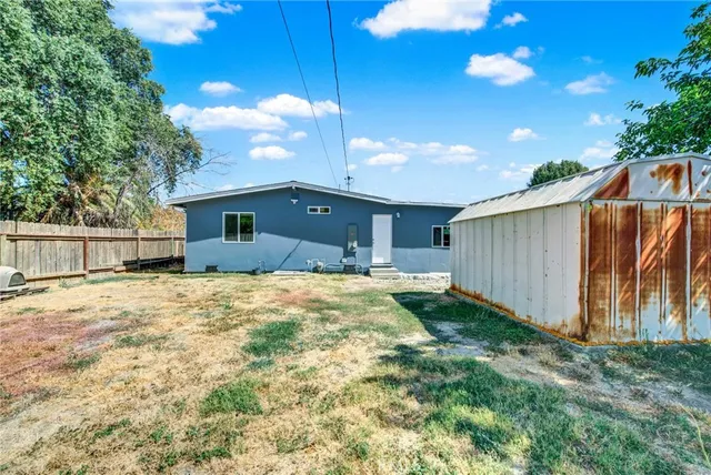 a view of backyard with green space