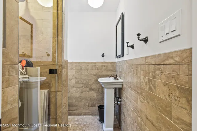 a bathroom with a bathtub and shower