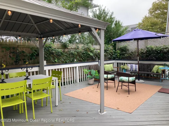a view of chairs and table in the patio
