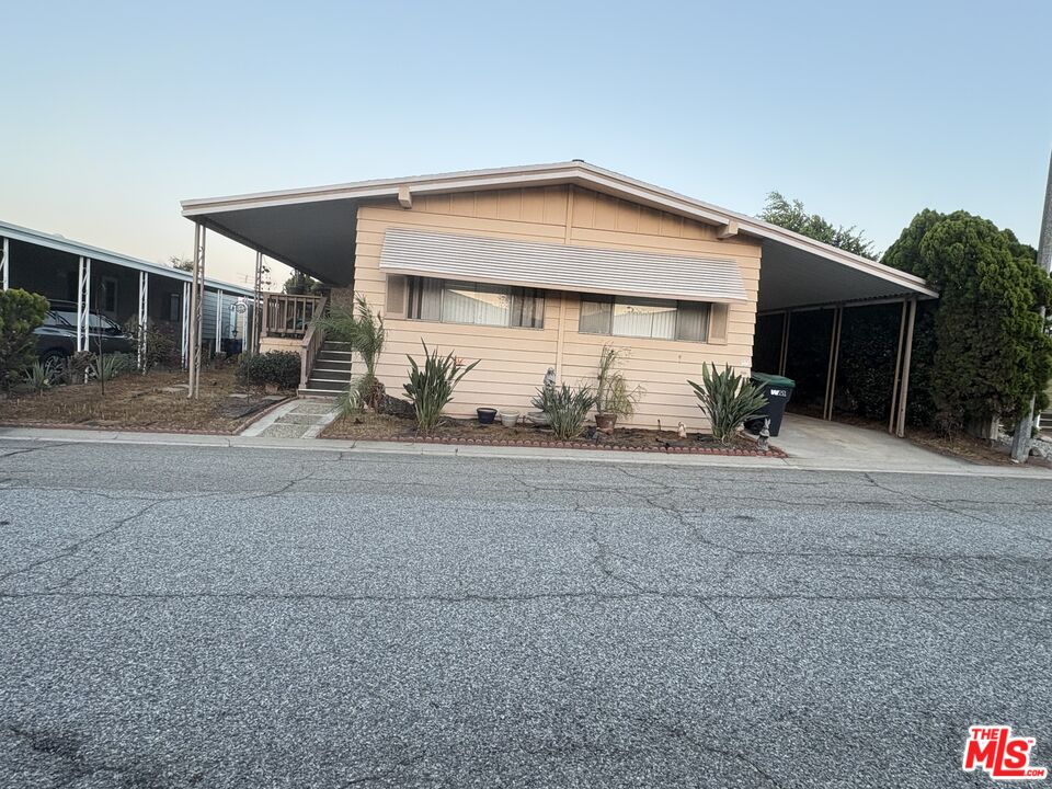 2601 East Victoria Street, Unit 99 Compton, CA 90220 - Photo 1 of 1 a view of a house with a patio