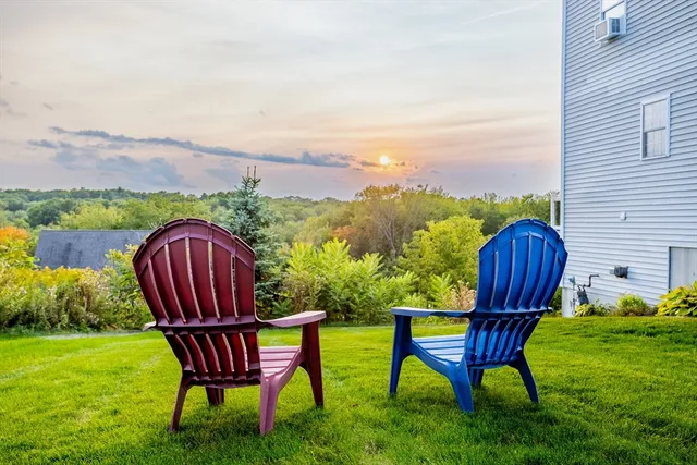 a view of a two chairs in the garden