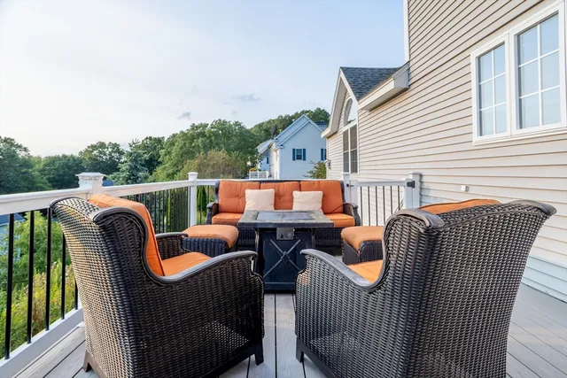 a balcony with furniture and outdoor seating