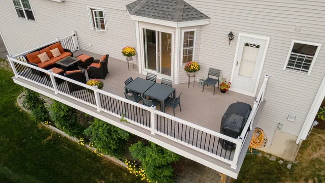 a view of a chairs and table in the balcony