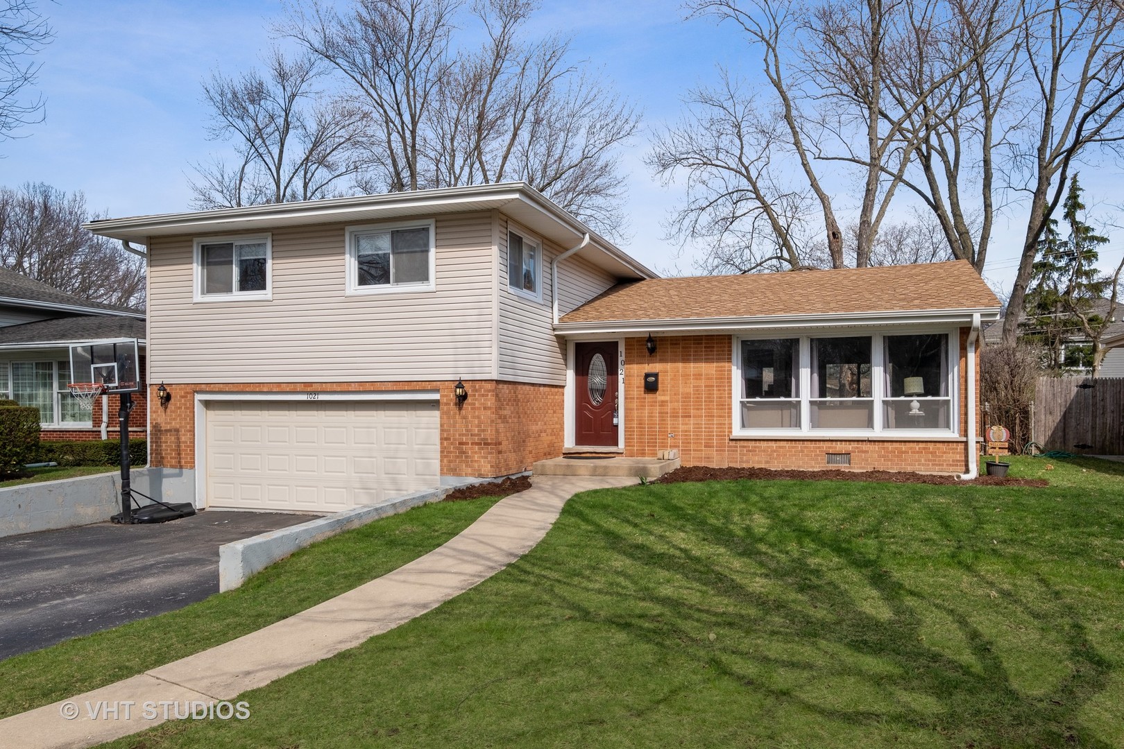 1021 Knollwood Road Deerfield, IL 60015 - Photo 1 of 20 a front view of a house with a yard