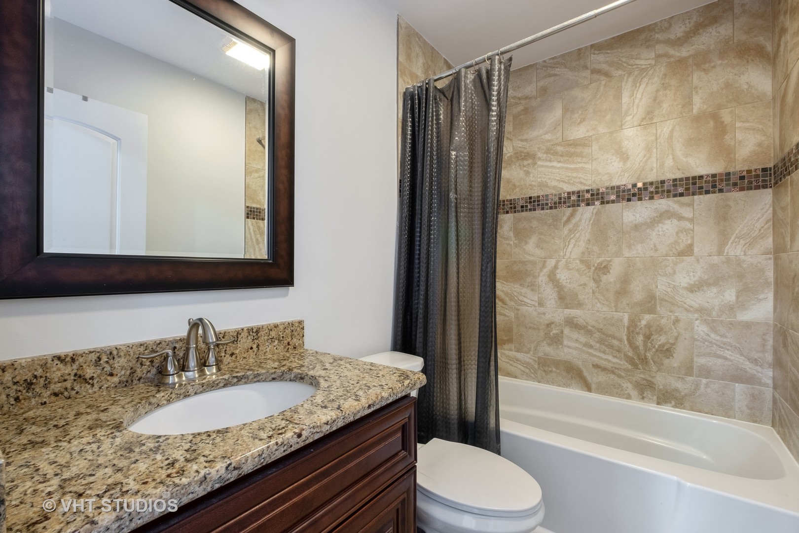 1021 Knollwood Road Deerfield, IL 60015 - Photo 13 of 20 a bathroom with a granite countertop sink toilet and shower