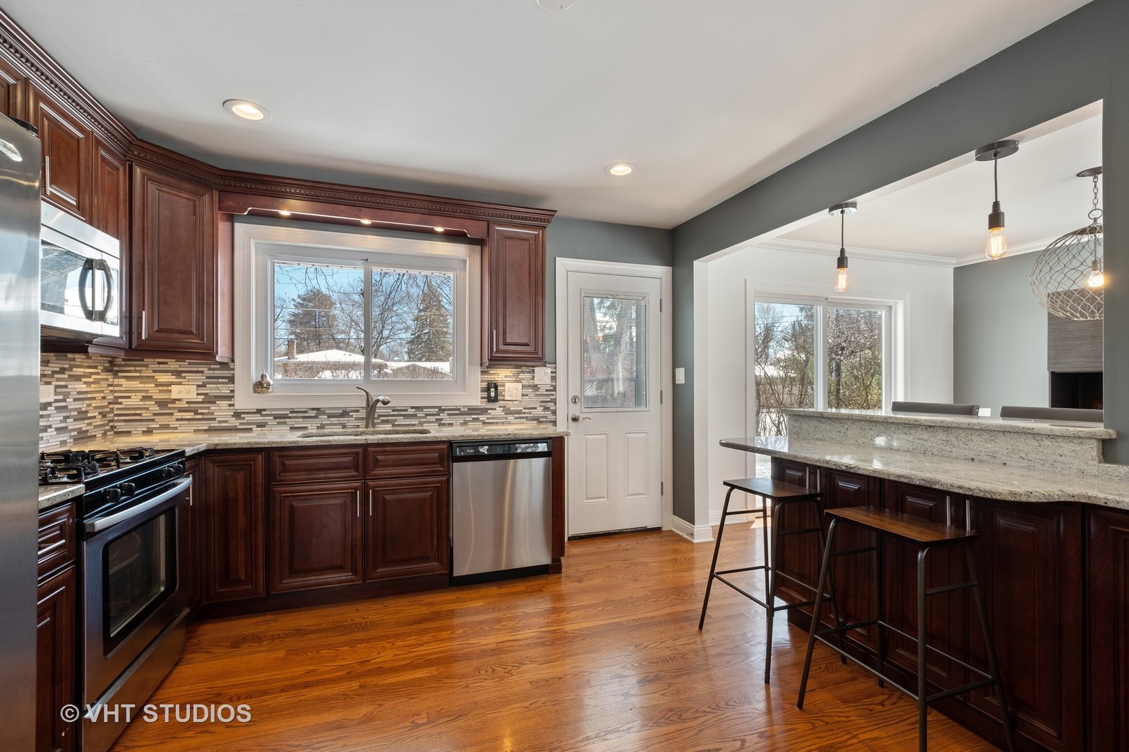 1021 Knollwood Road Deerfield, IL 60015 - Photo 6 of 20 a kitchen with stainless steel appliances granite countertop wooden cabinets a sink dishwasher a stove and a refrigerator