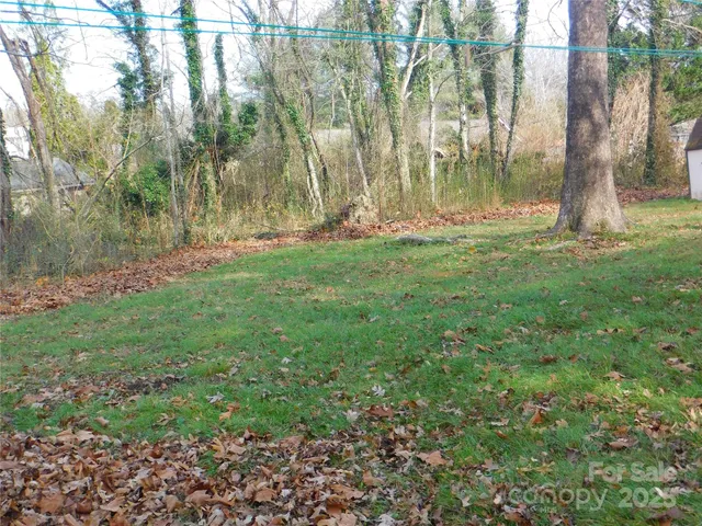 a view of outdoor space with deck and yard