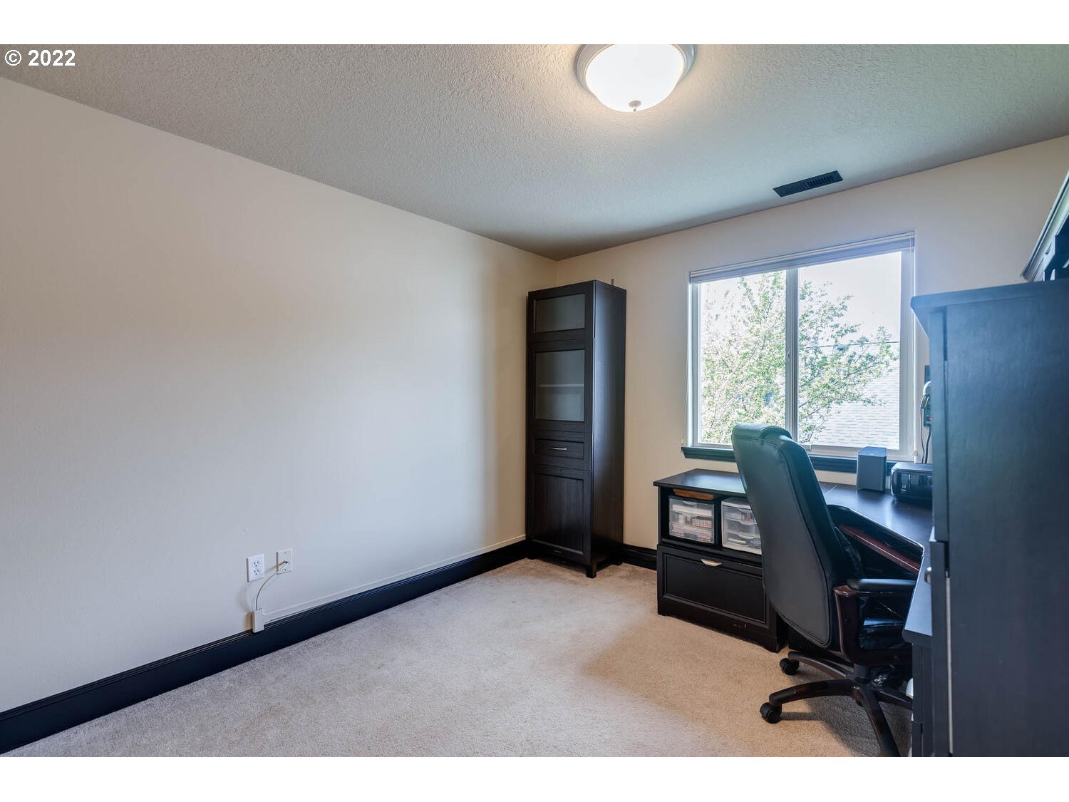 1013 Southwest Ivory Loop Gresham, OR 97080 - Photo 20 of 31 a view of a workspace with furniture and a window