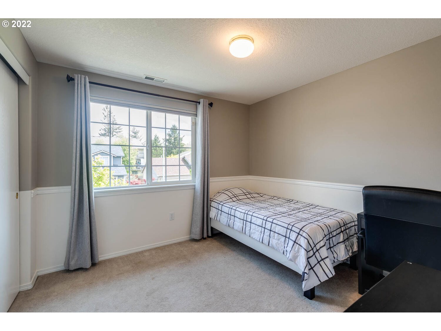 1013 Southwest Ivory Loop Gresham, OR 97080 - Photo 21 of 31 a bedroom with a bed and a window