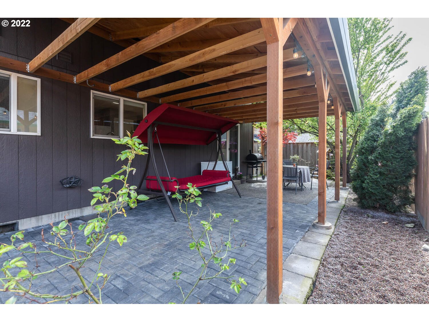 1013 Southwest Ivory Loop Gresham, OR 97080 - Photo 27 of 31 a view of a porch with a table and chairs