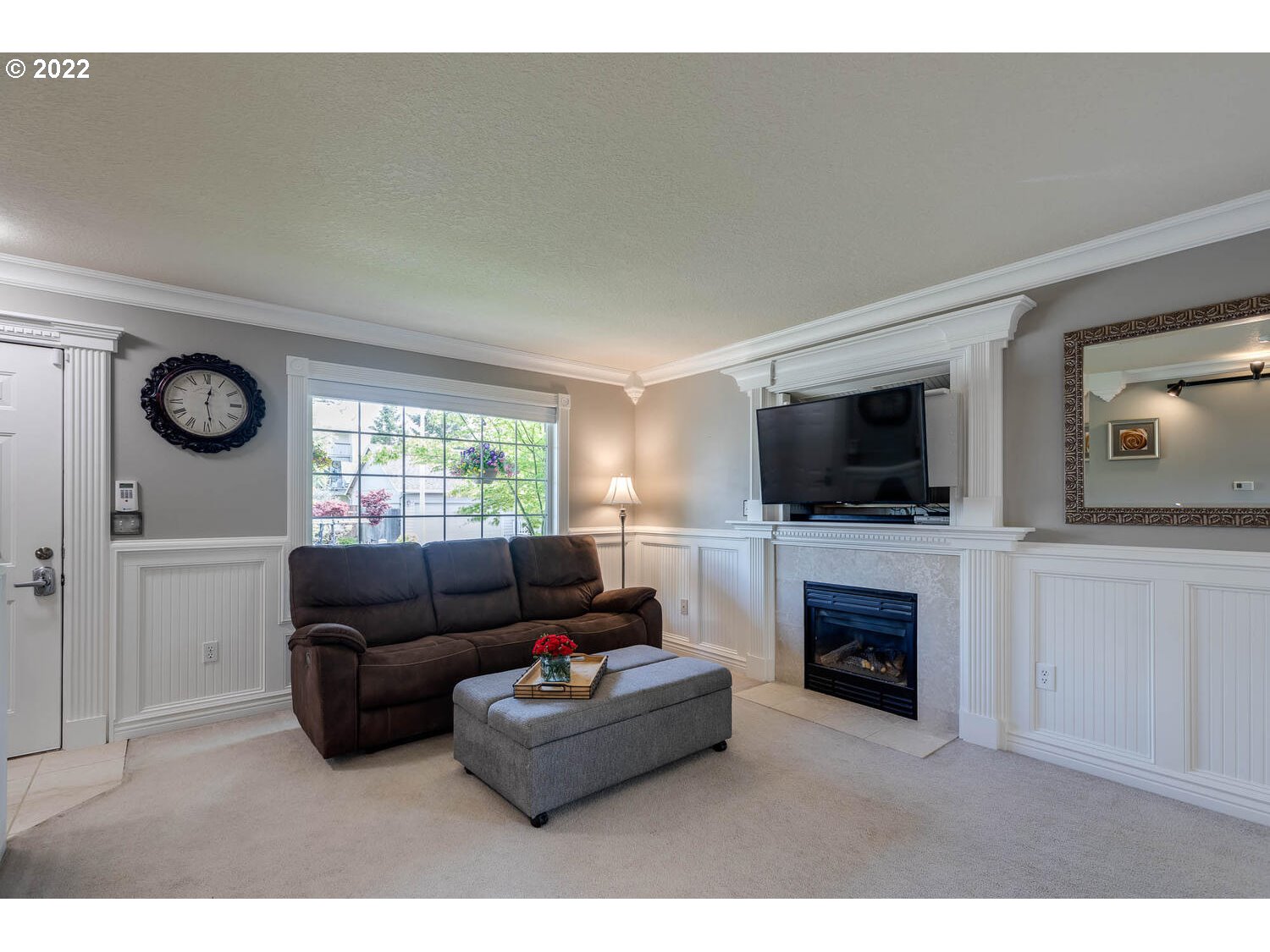 1013 Southwest Ivory Loop Gresham, OR 97080 - Photo 5 of 31 a living room with furniture a flat screen tv and a fireplace