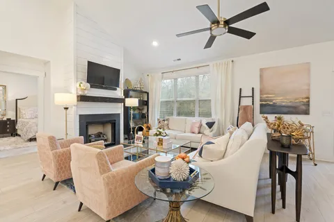 a living room with furniture and a fireplace