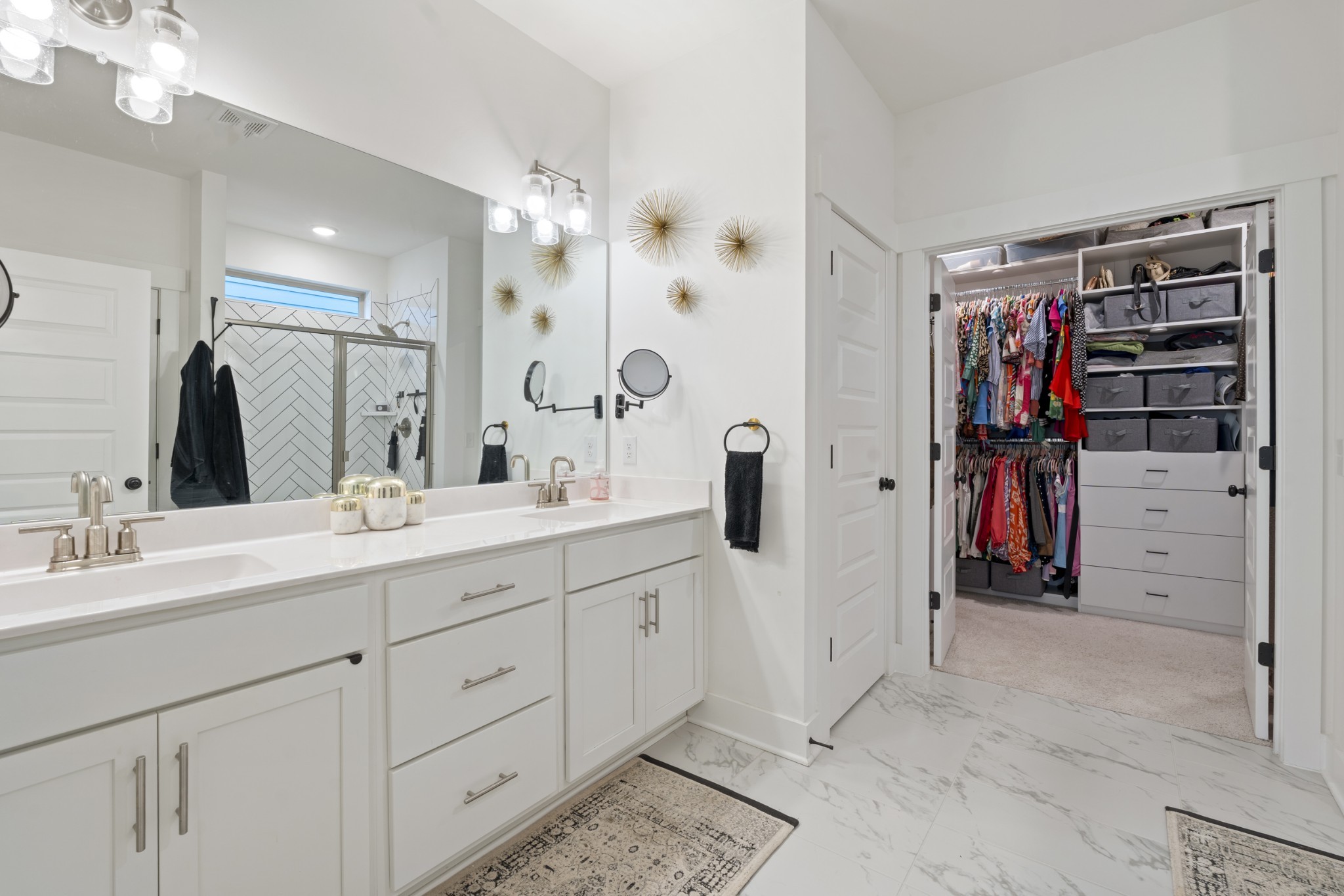 160 Cavalcade Loop Gallatin, TN 37066 - Photo 24 of 38 a bathroom with a double vanity sink a shower and a mirror