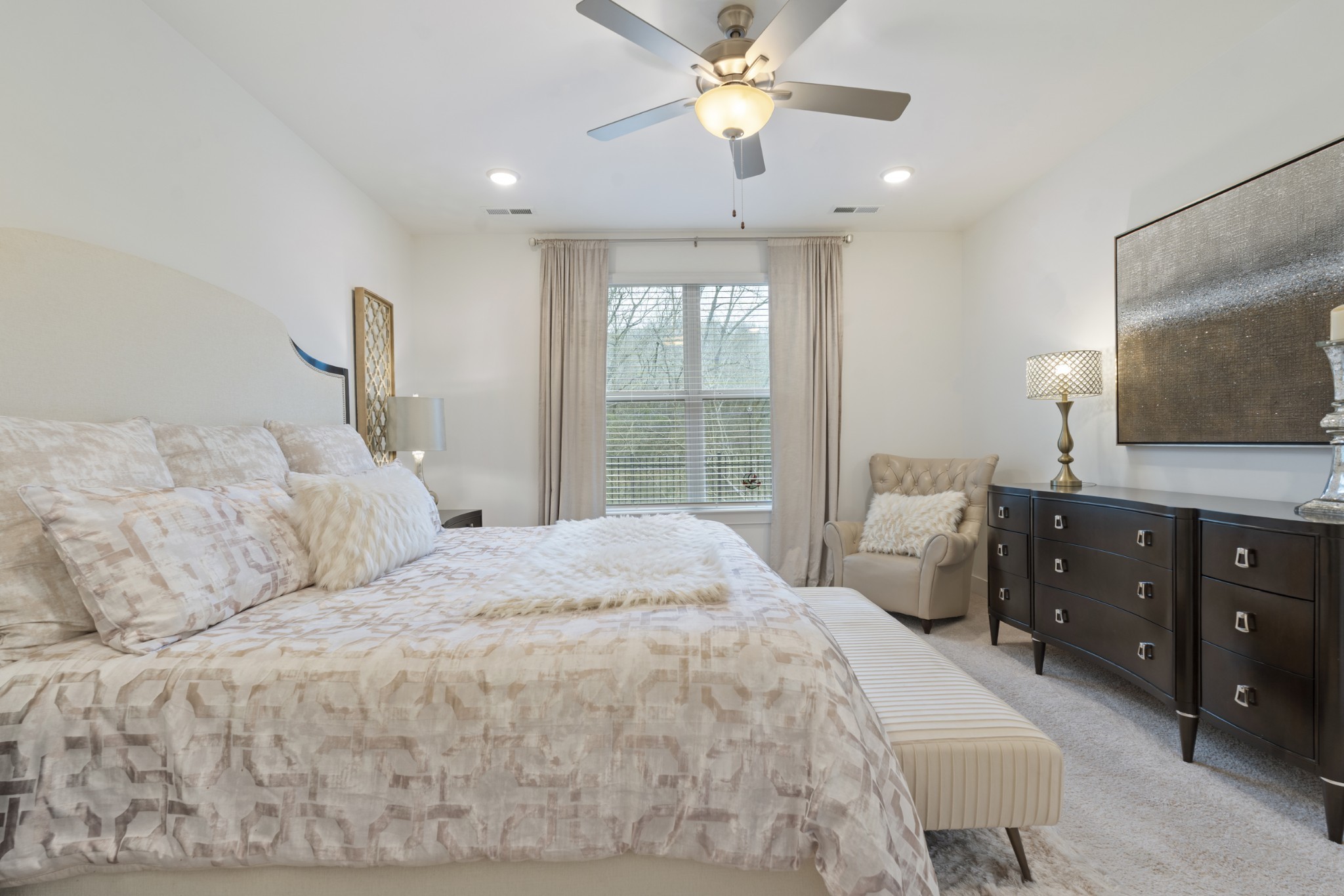 160 Cavalcade Loop Gallatin, TN 37066 - Photo 27 of 38 a bedroom with a large bed and a flat tv screen on dresser