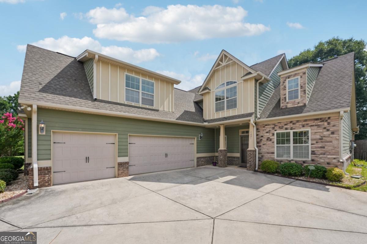 4007 Madison Acres Drive Locust Grove, GA 30248 - Photo 1 of 21 a view of a house with a yard and garage
