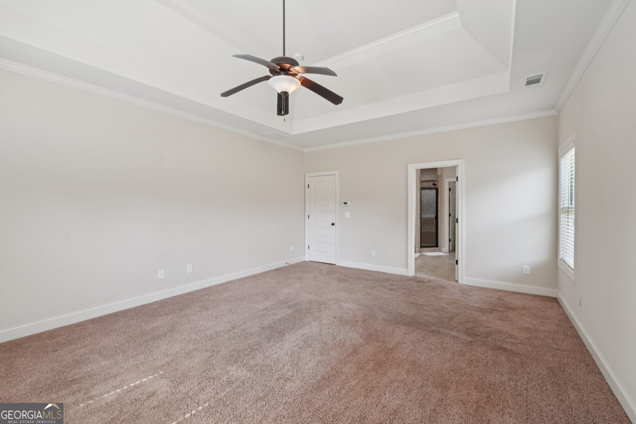 4007 Madison Acres Drive Locust Grove, GA 30248 - Photo 11 of 21 a view of an empty room with a chandelier fan