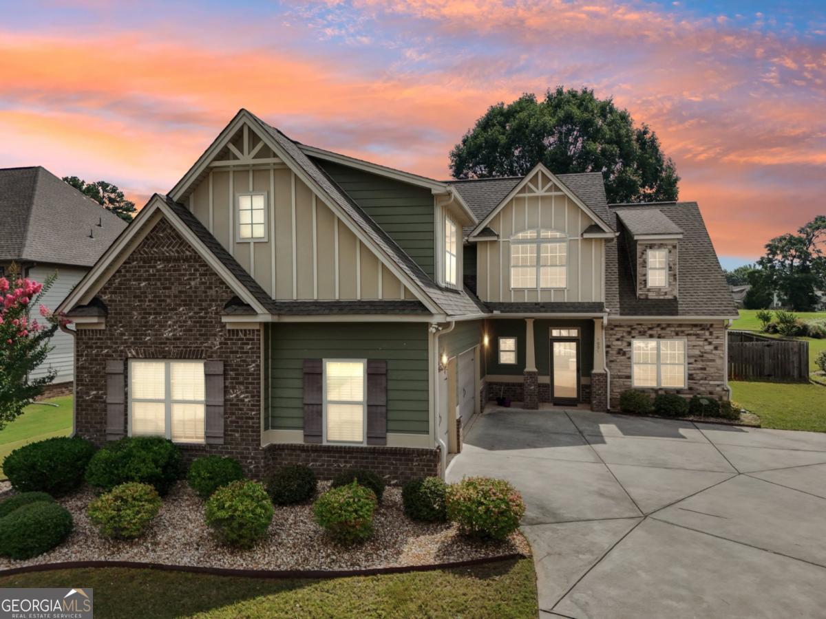 4007 Madison Acres Drive Locust Grove, GA 30248 - Photo 20 of 21 front view of a house with a yard