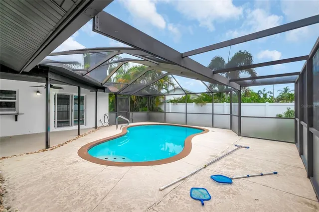 a view of a swimming pool with a porch