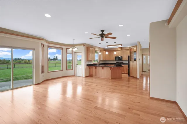a kitchen with granite countertop a sink and cabinets