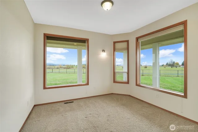 a view of empty room with windows