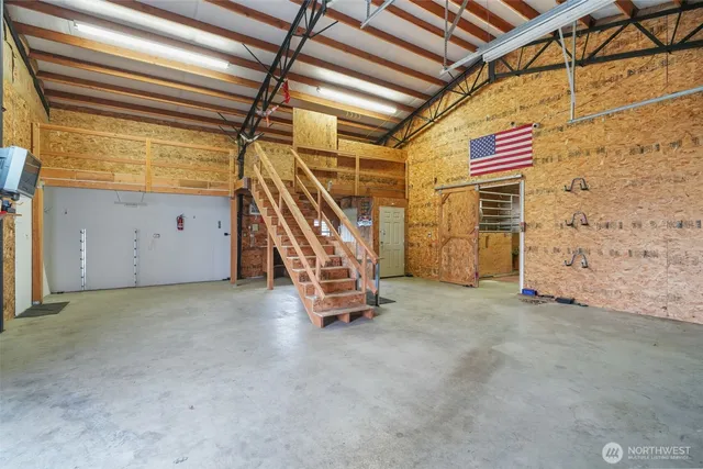 a view of an empty room with stairs