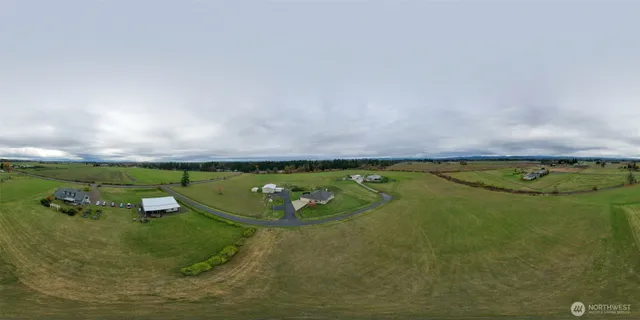 an aerial view of a house with outdoor space